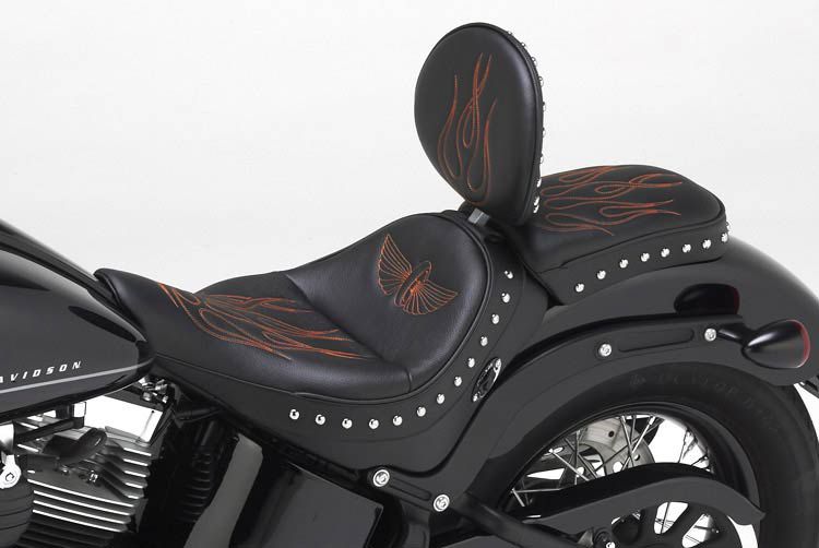 Natural grain black leather, black sides & welt, chrome studs, orange stitch and optional heater. #297-SB backrest.